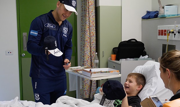 2018_11_30_Ablett_hero.jpg Gary Ablett shares a special moment with a young fan earlier this year - Geelong Cats